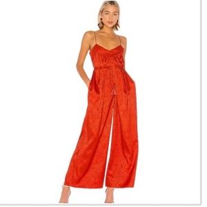 Red animal print jumpsuit with waist tie